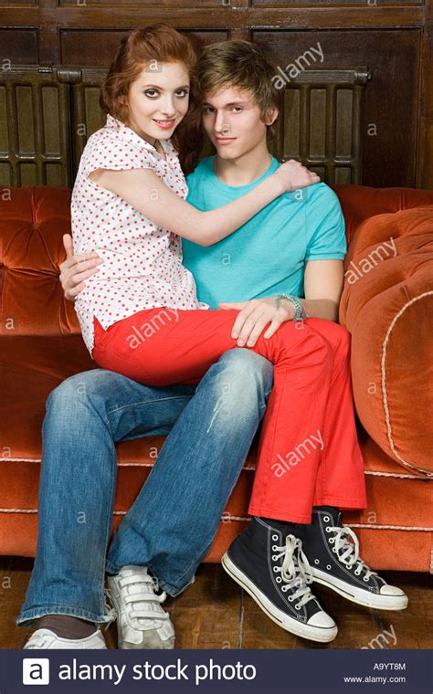 girl in boy lap|Teenage young girl sitting on boy's lap, romantic couple at .